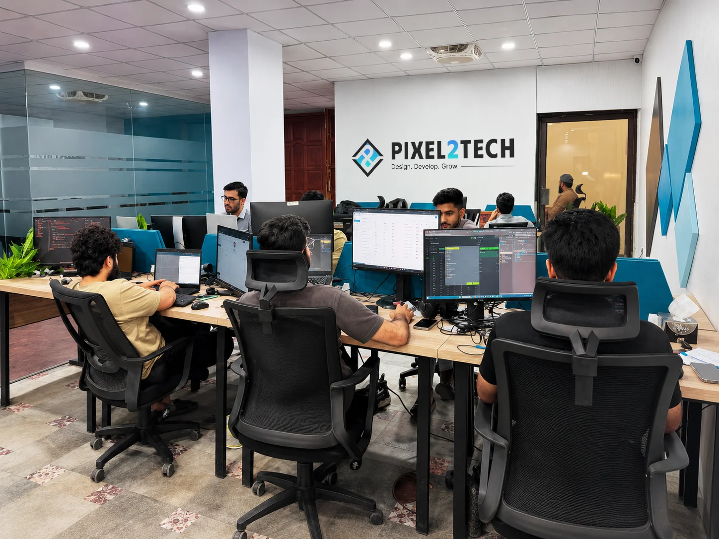 Inside the Pixel2Tech studio — team working at their desks