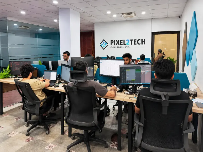 Pixel2Tech designers and developers working at their desks
